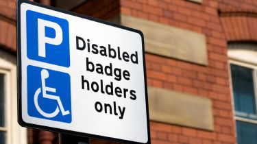 Disabled badge holder parking sign