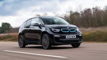 BMW i3 driving along road