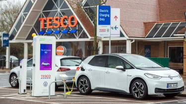 Electric VW ID3 car charging outside of Tesco, Potters bar, 24th November 2019