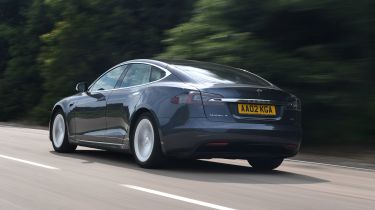 Tesla Model S driving rear